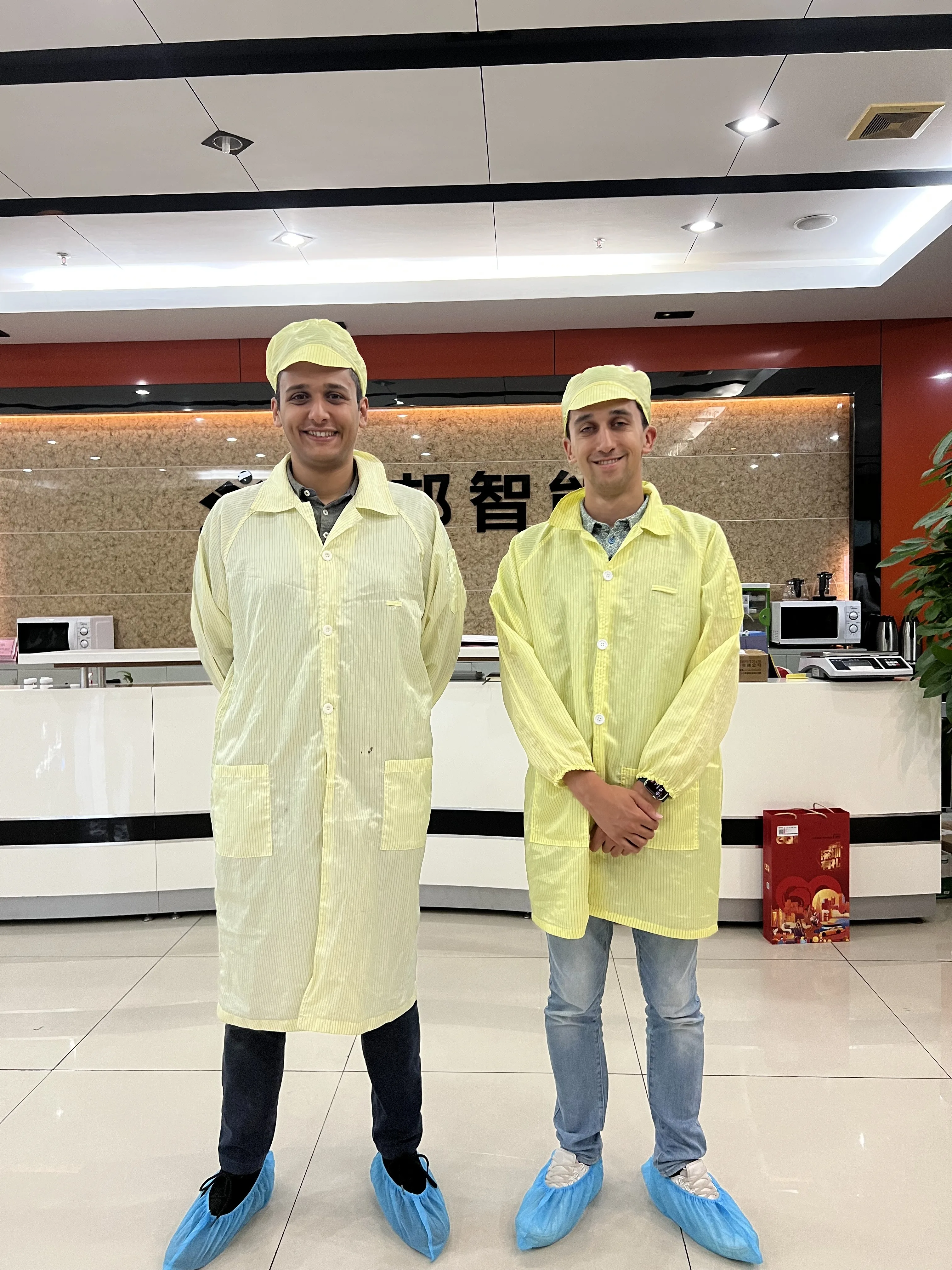 Insyght team in cleanroom suits at manufacturing facility